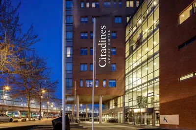 a building with a sign on the side of it at Citadines Sloterdijk Station Amsterdam in Amsterdam