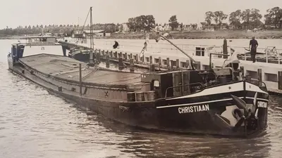 a black and white photo of a boat in the water at Hotelboat Angeline in Amsterdam