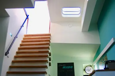 a stairway in a building with a stair case at Sailor Suite Coaster Mado in Amsterdam