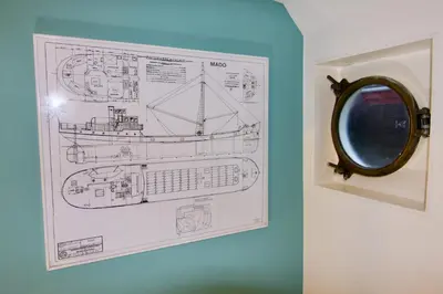 a framed drawing of a train on a wall at Sailor Suite Coaster Mado in Amsterdam