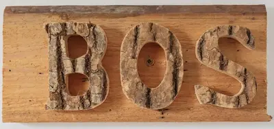 a wooden sign that says love on a wooden table at Wellness Bed & Breakfast Pergamo in Voorhout