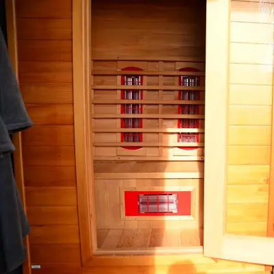 a closet with wood paneling and red glass at Wellness Bed & Breakfast Pergamo in Voorhout