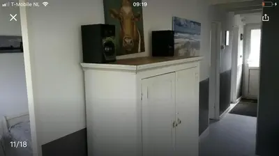 a room with a counter with speakers on top of it at Vakantiehuis Lara in Warmenhuizen