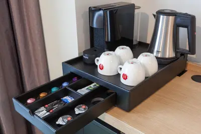 a table with a coffee pot andpotion at Best Western Plus Amstelveen - Amsterdam in Amstelveen