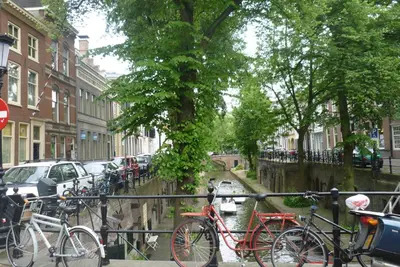 a group of bikes parked next to a canal at B&B Limes Oudwijk in Utrecht