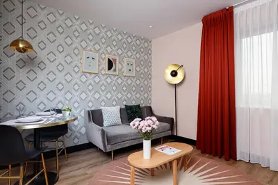 a living room with a couch and a table at Boutique Apartments Amsterdam in Amsterdam