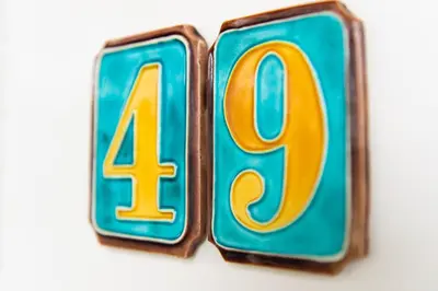 a close up of two blue and yellow numbers at Appartement Zuyd in Zandvoort