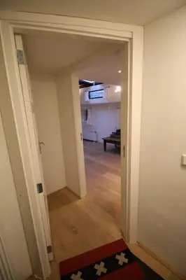 a hallway with an open door to a room at Nachtwacht Apartment in Amsterdam