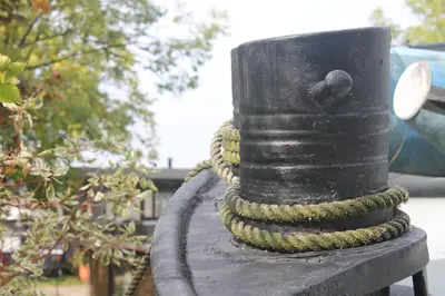 a black pole with a rope on it at Nachtwacht Apartment in Amsterdam