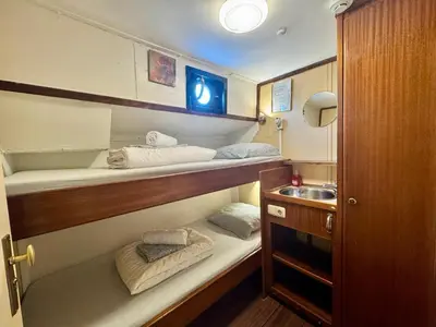 a small kitchen with a sink and some towels at Passengership Avanti in Amsterdam