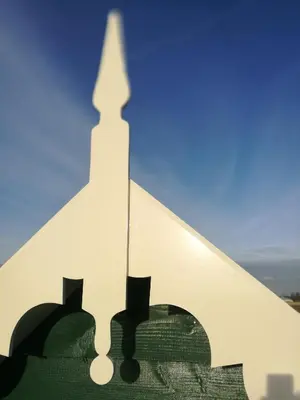 a view of a clock tower from a window at De Groene Bollenschuur in Hillegom
