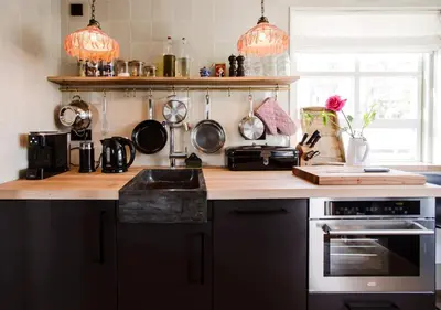 a kitchen with a counter top with pots and pans at SWEETS - Amstelschutsluis in Amsterdam