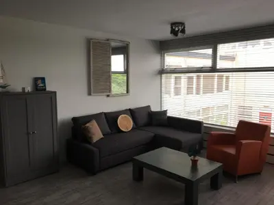 a living room with a couch and a coffee table at Amsterdam Beach Home 46 in Zandvoort
