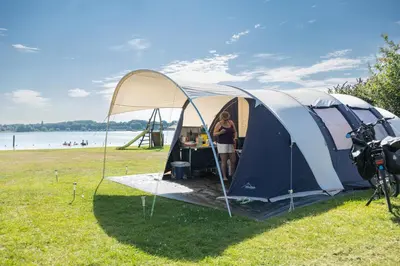 a woman standing in front of a tent at RCN Zeewolde in Zeewolde