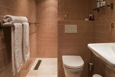 a bathroom with a toilet and a sink at De Buren in Vleuten