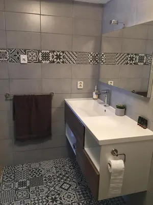 a bathroom with a sink and a mirror at Garden Room or Economy Room in Amsterdam