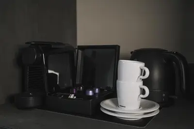 a black box with a white cup on a table at Hotel Bell in Zandvoort