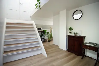a room with white shelves and a table and a mirror at Eco HouseBoat in Amsterdam