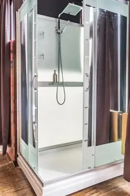a shower in a room with a glass door at BEAUTIFUL APARTMENT WiTH ASIAN STYLE BEDROOM NEAR RAI & CENTER in Amsterdam