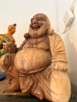 a statue of a man holding a ball and a teddy bear at BEAUTIFUL APARTMENT WiTH ASIAN STYLE BEDROOM NEAR RAI & CENTER in Amsterdam
