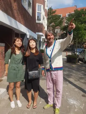 a man and two women standing on a sidewalk at BEAUTIFUL APARTMENT WiTH ASIAN STYLE BEDROOM NEAR RAI & CENTER in Amsterdam