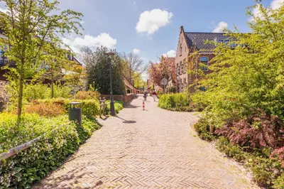 a cobblestone street in a city with buildings at Studio Clematis in Bergen