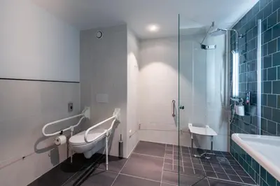 a bathroom with a toilet and a sink and a shower at Holiday Inn - the niu, Fender Amsterdam in Amsterdam