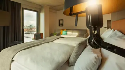a hotel room with two beds and a window at Holiday Inn - the niu, Fender Amsterdam in Amsterdam