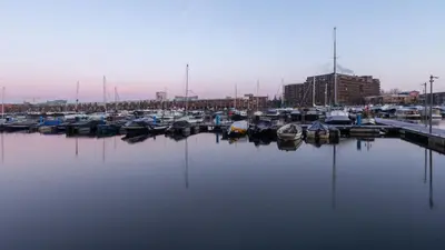 a bunch of boats docked in a harbor at Holiday Inn - the niu, Fender Amsterdam in Amsterdam