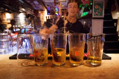 a group of four glasses sitting on a table at Flying Pig Downtown in Amsterdam