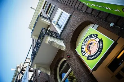 a sign on the side of a building at Flying Pig Uptown in Amsterdam