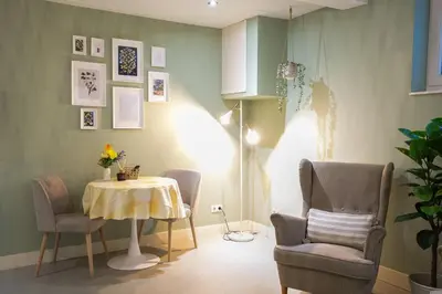 a dining room with a table and two chairs and a table and chairsktop at NEW! Modern Gallery Nassau Canal Suite in Amsterdam