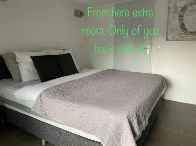 a bed in a bedroom with the words from here extra room only of you book at Zomerhuis Wonders in Zandvoort