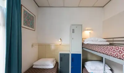 a small room with two bunk beds in it at Euphemia Budget Old City Canal Zone in Amsterdam
