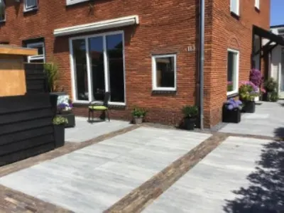 a brick building with a patio in front of it at Sunny dunes in Zandvoort