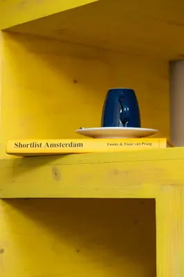 a wooden shelf with a surfboard on top of it at Rosalia's Menagerie Cocktail bar & InnUpstairs in Amsterdam