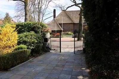 a gate in front of a house at Cavalli's Cottage in Bilthoven