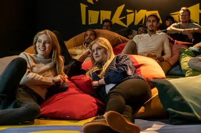 a group of people sitting on a pile of pillows at Via Suites in Amsterdam