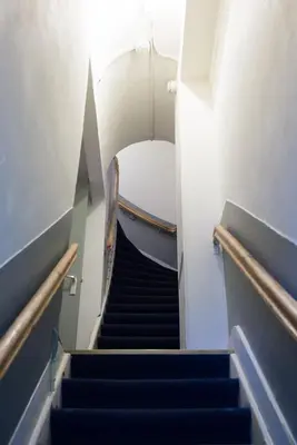 a staircase with blue steps in a building at Hotel Amsterdam Inn in Amsterdam