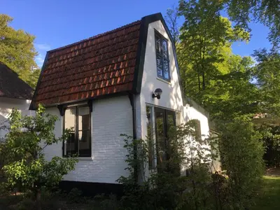 a white house with a brown roof at Little Constantia in Bergen