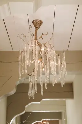 a chandelier hanging from a ceiling in a room at Inn on the Lake in Broek in Waterland