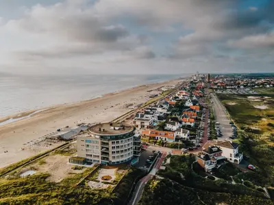 an aerial view of a beach and a city at Joy at the Beach in Zandvoort