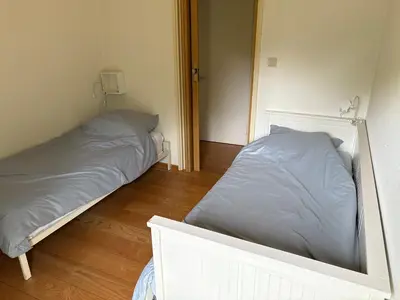 a bedroom with two beds in a room at Gouweland in Hoogwoud