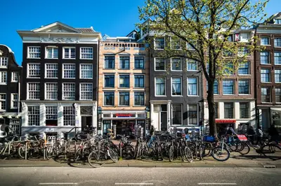 a bunch of bikes parked in front of buildings at Beautiful DutchHouse Centrum in Amsterdam