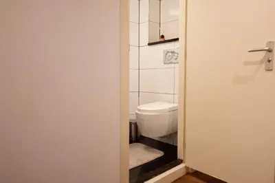 a small bathroom with a toilet in a room at Beautiful DutchHouse Centrum in Amsterdam
