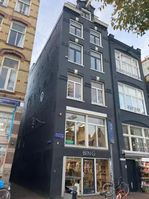 a black building with a bike parked in front of it at City Center Studio Amsterdam in Amsterdam