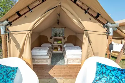 a canvas tent with two beds in it at Marinaparcs Almere in Almere