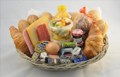 a basket filled with food and bread and eggs at Klavergeluk in Amsterdam