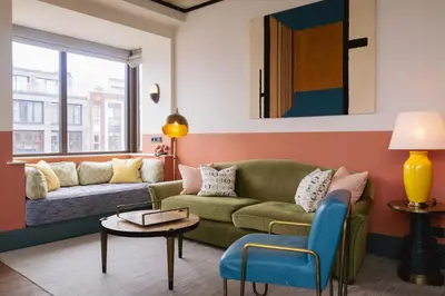 a living room with a couch and a table at The July - Boat & Co in Amsterdam