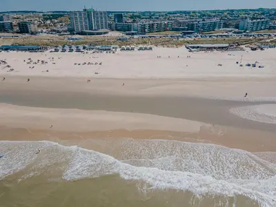 an aerial view of a beach with people on it at BUDDHA BEACH BUNGALOWS Adults Only in Zandvoort